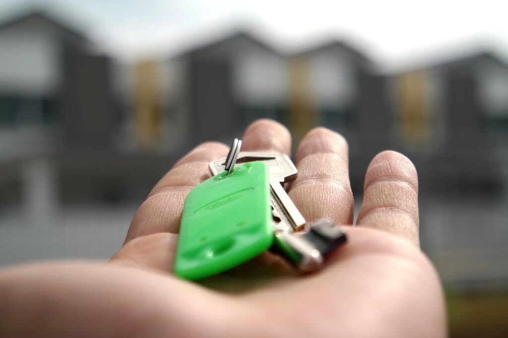 a key on top of a palm of a hand