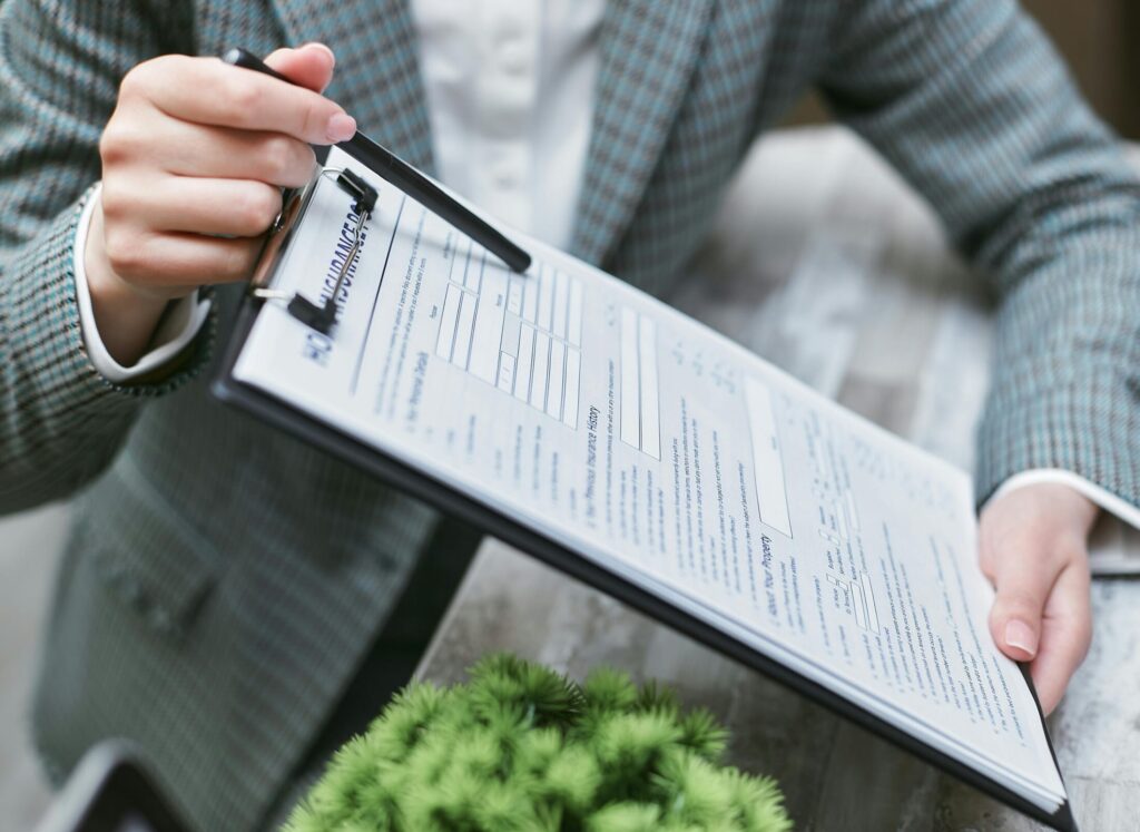 a person handing out an insurance policy