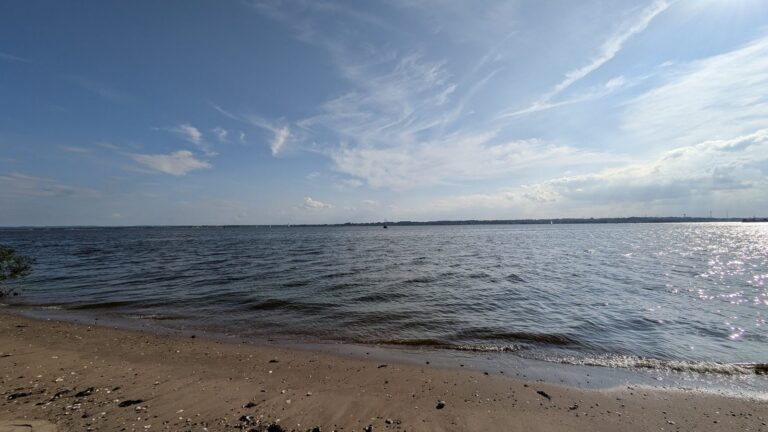 Shallow water washing over sand on the Tottenville beach