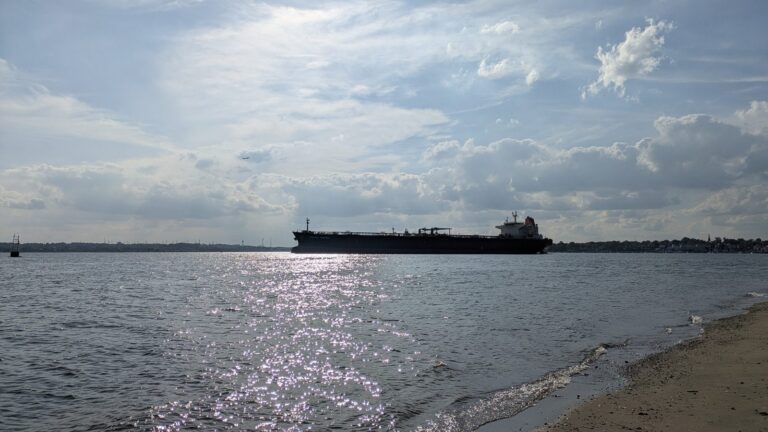 A tanker crossing the horizon on Raritan Bay seen from the Tottenville shore