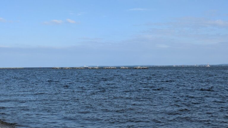 Living Breakwaters segments along the horizon on Raritan Bay off Tottenville